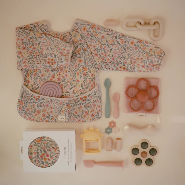 Mushie Slabbetje Lange Mouwen Pastel Blooms koop je bij Babywinkel